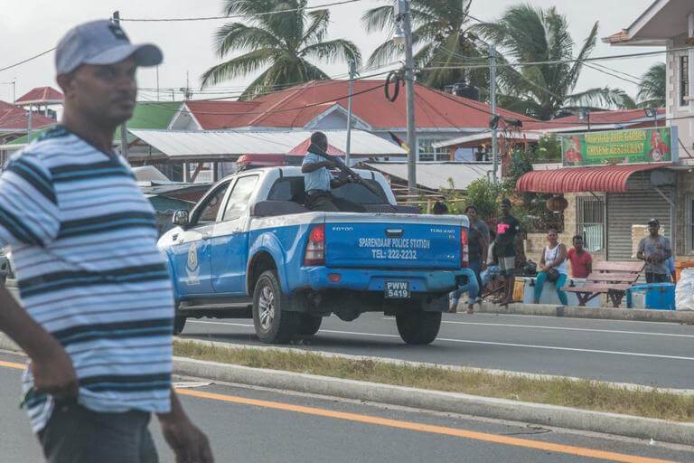 A policeman on a pickup truck carrying an assault gun during the protests.